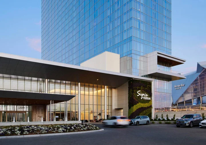 Signia by Hilton Atlanta entrance with Mercedes-Benz Stadium beside it